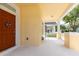 Covered porch with a welcoming entrance, offering a view of the pleasant neighborhood at 14741 Sapodilla Dr, Orlando, FL 32828