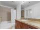 Well-lit bathroom featuring granite countertops, modern fixtures, and a shower-tub combo at 155 S Court Ave # 2008, Orlando, FL 32801