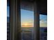 A great city view through open curtains at 155 S Court Ave # 2008, Orlando, FL 32801