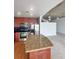 Modern kitchen with stainless steel appliances and granite countertops, open to the living area at 155 S Court Ave # 2008, Orlando, FL 32801