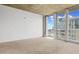 Bright living room features large windows and neutral carpeting for a modern, airy feel at 155 S Court Ave # 2008, Orlando, FL 32801