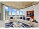 Stylishly furnished living room with comfortable seating and a view of the city skyline at 155 S Court Ave # 2008, Orlando, FL 32801