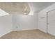 Loft with neutral carpeting, exposed concrete ceiling, and modern lighting fixtures at 155 S Court Ave # 2008, Orlando, FL 32801