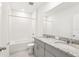 Bathroom featuring a double sink vanity with granite countertop and a shower-tub combo at 1737 Forest Run Ln, Auburndale, FL 33823