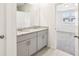 Bathroom featuring a double vanity with granite countertops and modern finishes at 1737 Forest Run Ln, Auburndale, FL 33823
