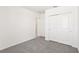 Bedroom featuring neutral carpeting, sliding door closet, and a white trim at 1737 Forest Run Ln, Auburndale, FL 33823
