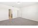 Light-filled bedroom with plush carpet and access to ensuite bathroom and walk-in closet at 1737 Forest Run Ln, Auburndale, FL 33823