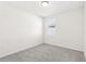 Bedroom featuring neutral carpet, a window with blinds, and ample natural light at 1737 Forest Run Ln, Auburndale, FL 33823