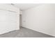 Bedroom featuring neutral carpeting, sliding door closet, and a white trim at 1737 Forest Run Ln, Auburndale, FL 33823