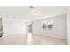 Bright living room featuring tile flooring, large windows, and sliding door access to the backyard at 1737 Forest Run Ln, Auburndale, FL 33823