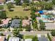 Aerial view of a neighborhood showcasing the community pool, landscaping, and homes at 1741 Palmer Ave, Winter Park, FL 32789