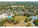 Expansive aerial view of the neighborhood highlighting the pool, school, and tennis courts at 1741 Palmer Ave, Winter Park, FL 32789
