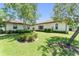 Green backyard and grassy area with trees and shrubs at 1741 Palmer Ave, Winter Park, FL 32789