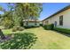 Green backyard and grassy area with trees and shrubs at 1741 Palmer Ave, Winter Park, FL 32789