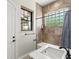 Bright bathroom features a shower with glass blocks and a modern sink at 1741 Palmer Ave, Winter Park, FL 32789