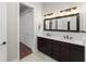 Bathroom featuring dual sinks, ample counter space, and a closet with sliding doors at 1741 Palmer Ave, Winter Park, FL 32789