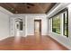 Bedroom with wood floors, wood ceiling, large windows, and views into the other living spaces at 1741 Palmer Ave, Winter Park, FL 32789