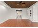 Bedroom with wood floors, wood ceiling, and glass doors to another room in the home at 1741 Palmer Ave, Winter Park, FL 32789