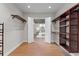 Spacious walk-in closet featuring wood floors and custom shelving at 1741 Palmer Ave, Winter Park, FL 32789