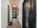 Stunning entryway with a brick arch, herringbone tile flooring, and unique lighting fixtures at 1741 Palmer Ave, Winter Park, FL 32789