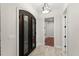 Elegant entryway with wrought-iron doors, stylish lighting, and wood-look tile flooring at 1741 Palmer Ave, Winter Park, FL 32789