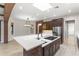 Kitchen island with cooktop and breakfast bar, perfect for casual dining and entertaining at 1741 Palmer Ave, Winter Park, FL 32789