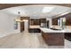 Open kitchen with wine fridge, stainless appliances, brick accents, and skylight that offers abundant natural light at 1741 Palmer Ave, Winter Park, FL 32789
