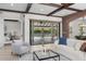 Bright living room with access to the patio and a glimpse of the adjacent bedroom, featuring neutral tones at 1741 Palmer Ave, Winter Park, FL 32789