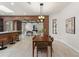 Bright and airy living space with brick accents, open to dining room with breakfast bar, perfect for entertaining at 1741 Palmer Ave, Winter Park, FL 32789