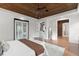 Open and airy main bedroom with a wood ceiling and multiple access points to other rooms, enhancing the spacious feel at 1741 Palmer Ave, Winter Park, FL 32789