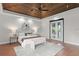 Serene main bedroom featuring wood ceiling, neutral tones, and double doors leading to an outdoor area at 1741 Palmer Ave, Winter Park, FL 32789