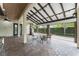 Spacious outdoor kitchen with brick flooring, solar panel roof, and comfortable seating area at 1741 Palmer Ave, Winter Park, FL 32789