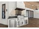 Covered patio featuring a stainless steel outdoor kitchen with a built-in grill and granite counters at 1741 Palmer Ave, Winter Park, FL 32789