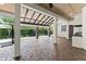 A covered patio features a brick floor, a stainless steel outdoor kitchen, and sliding glass doors at 1741 Palmer Ave, Winter Park, FL 32789