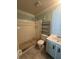 Bathroom featuring a walk-in shower, toilet, shelving unit, and single sink vanity at 2009 Nottingdale Ln, Winter Park, FL 32792