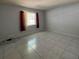 Bright bedroom with tile flooring and a large window, great for relaxation at 2009 Nottingdale Ln, Winter Park, FL 32792