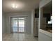 Bright dining area with sliding glass doors to the patio and an open layout to the kitchen at 2009 Nottingdale Ln, Winter Park, FL 32792
