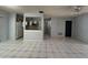 Expansive living room with tile flooring, and an open layout to the kitchen at 2009 Nottingdale Ln, Winter Park, FL 32792