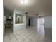Open-concept living space with tile flooring and easy access to the kitchen and other rooms at 2009 Nottingdale Ln, Winter Park, FL 32792