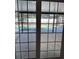 View from inside the house to the screened in pool and patio area at 2009 Nottingdale Ln, Winter Park, FL 32792