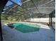 Inviting screened-in pool area with clear water, concrete patio, and lush green surroundings at 2009 Nottingdale Ln, Winter Park, FL 32792