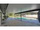 Enjoy a beautiful swimming pool surrounded by a screened-in enclosure and concrete deck at 2009 Nottingdale Ln, Winter Park, FL 32792
