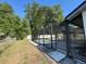 Screened in pool and patio area surrounded by fenced yard at 2009 Nottingdale Ln, Winter Park, FL 32792