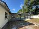 Exterior screened-in pool and covered patio at 2009 Nottingdale Ln, Winter Park, FL 32792