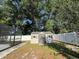 Outdoor shed situated near a pool, surrounded by fencing and mature trees at 2009 Nottingdale Ln, Winter Park, FL 32792