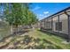 View of the property's backyard featuring a screened-in lanai at 2028 Donegan Pl, Orlando, FL 32826