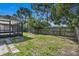 Spacious backyard featuring a screened-in lanai and a wood fence for added privacy at 2028 Donegan Pl, Orlando, FL 32826
