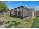 A screened-in lanai overlooks the backyard, offering a relaxing outdoor space at 2028 Donegan Pl, Orlando, FL 32826