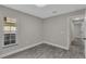 This bedroom features wood-look flooring and a sunny window at 2028 Donegan Pl, Orlando, FL 32826