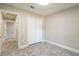 Bedroom features gray flooring, a standard closet, and an ensuite bathroom at 2028 Donegan Pl, Orlando, FL 32826